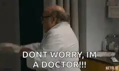 Danny DeVito puts on a glove