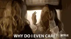 woman looking in mirror why do i even care