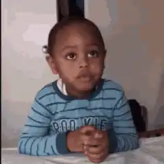 Confused little boy shrugging