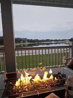 Fire pit on balcony overlooking lake