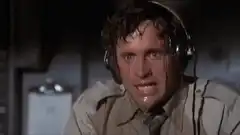 Man sweating profusely under headphones