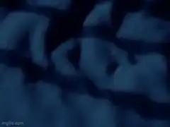 Hands pulling back blue blanket