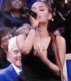 Ariana Grande sings to Bill Clinton