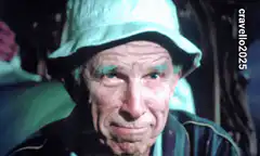 Old man with blue eyebrows laughing