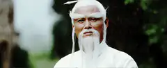 Old man strokes white beard