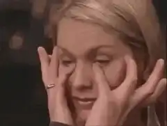 Woman rubbing her eyes