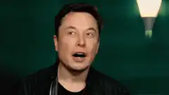 Elon Musk talking with surprised expression