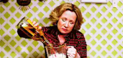 Woman pouring beer into blender