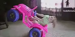 Toddler falls out of pink toy truck