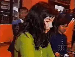 Woman in green shirt gets hit by a white dog