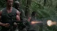Soldiers firing machine guns in jungle