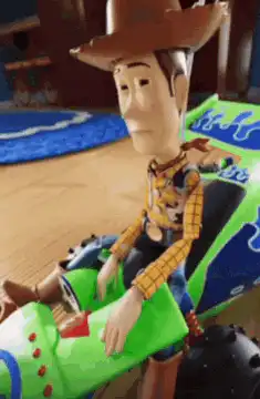 Woody toy falls over
