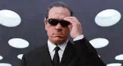 Men in Black agents remove sunglasses