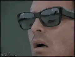 Man puts on second pair of sunglasses