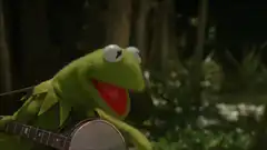 Kermit the Frog playing banjo in swamp