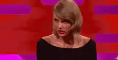 Taylor Swift talking and gesturing