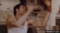 John Travolta pointing at golden glove