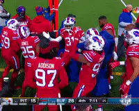 Buffalo Bills players celebrate on field