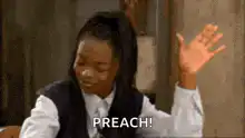 Girl raising hand saying PREACH