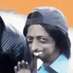 Man in cap smiling and waving