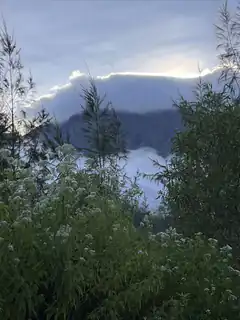 mountain peak above clouds
