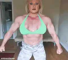 Muscular woman flexing arms