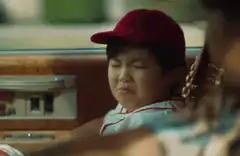 Young boy making a sour face