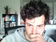 man resting chin on hand