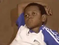 Boy on couch looking bored