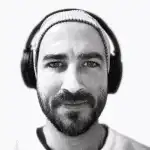 Man with headphones eyes glow