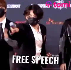 Man points microphone at camera free speech