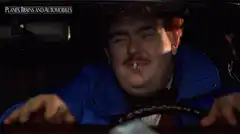 John Candy driving with cigarette
