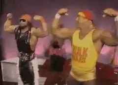 Hulk Hogan and Ultimate Warrior flexing