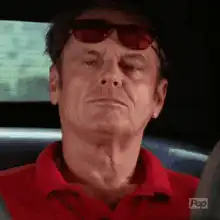 Jack Nicholson driving with sunglasses