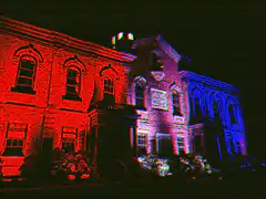 Red and blue lit building at night