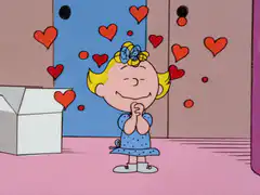Sally Brown surrounded by hearts