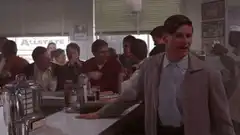 Biff Tannen drinks milkshake and wipes mouth