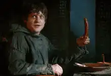 Samwise Gamgee holding a sausage