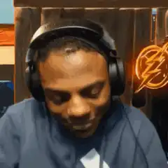 Man in headphones smiling and nodding