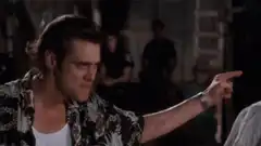 Jim Carrey pointing and looking up