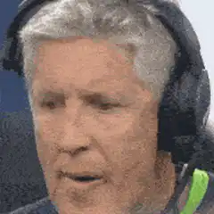 Alex Ferguson talking with headphones