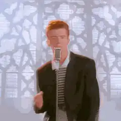 Rick Astley singing into a microphone