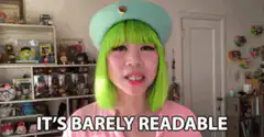 Woman in green wig says it's barely readable