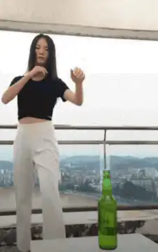 Woman kicks bottle cap off