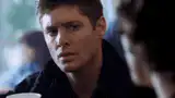 Dean Winchester looks down then up surprised
