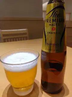 Suntory The Premium Malt's beer bottle and glass