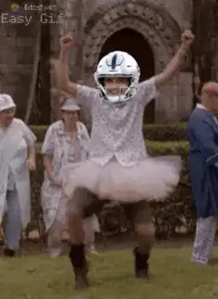football player in tutu dancing