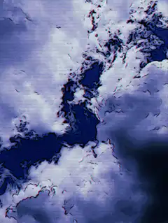 Blue and white clouds swirl into a vortex
