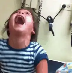 Girl screaming in a doctor's office