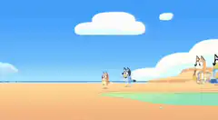 Bluey and Bingo on the beach